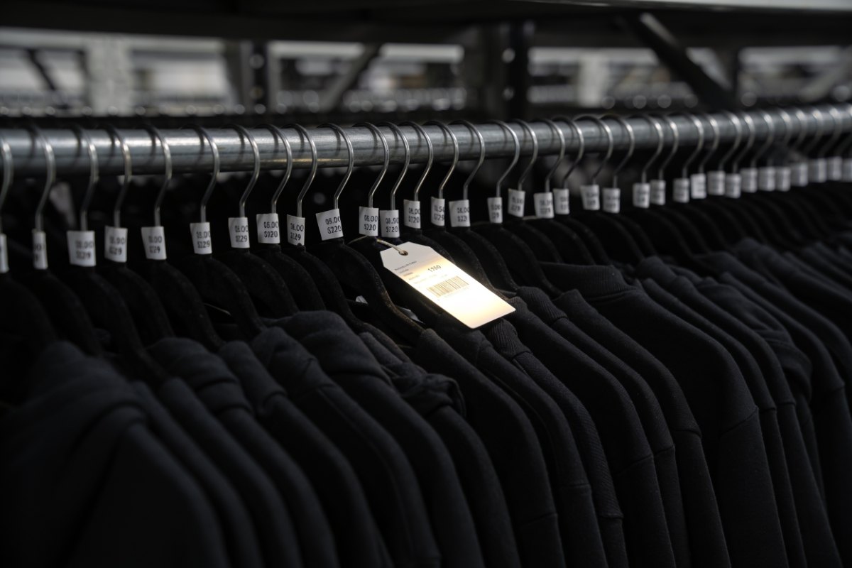 Rack of end-of-season Korean brand apparel with wholesale price hang-tags