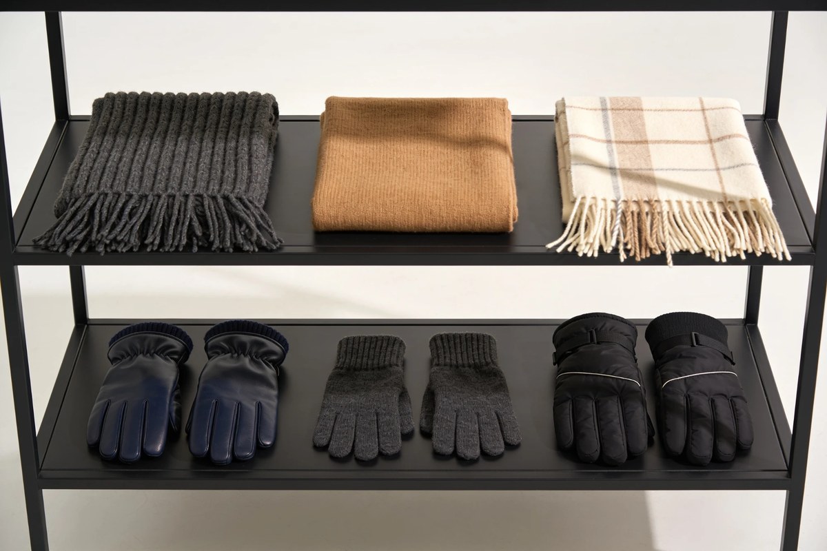 Representative lot of scarves and gloves - charcoal, camel and checked wool scarves above navy leather, grey knit and black padded gloves